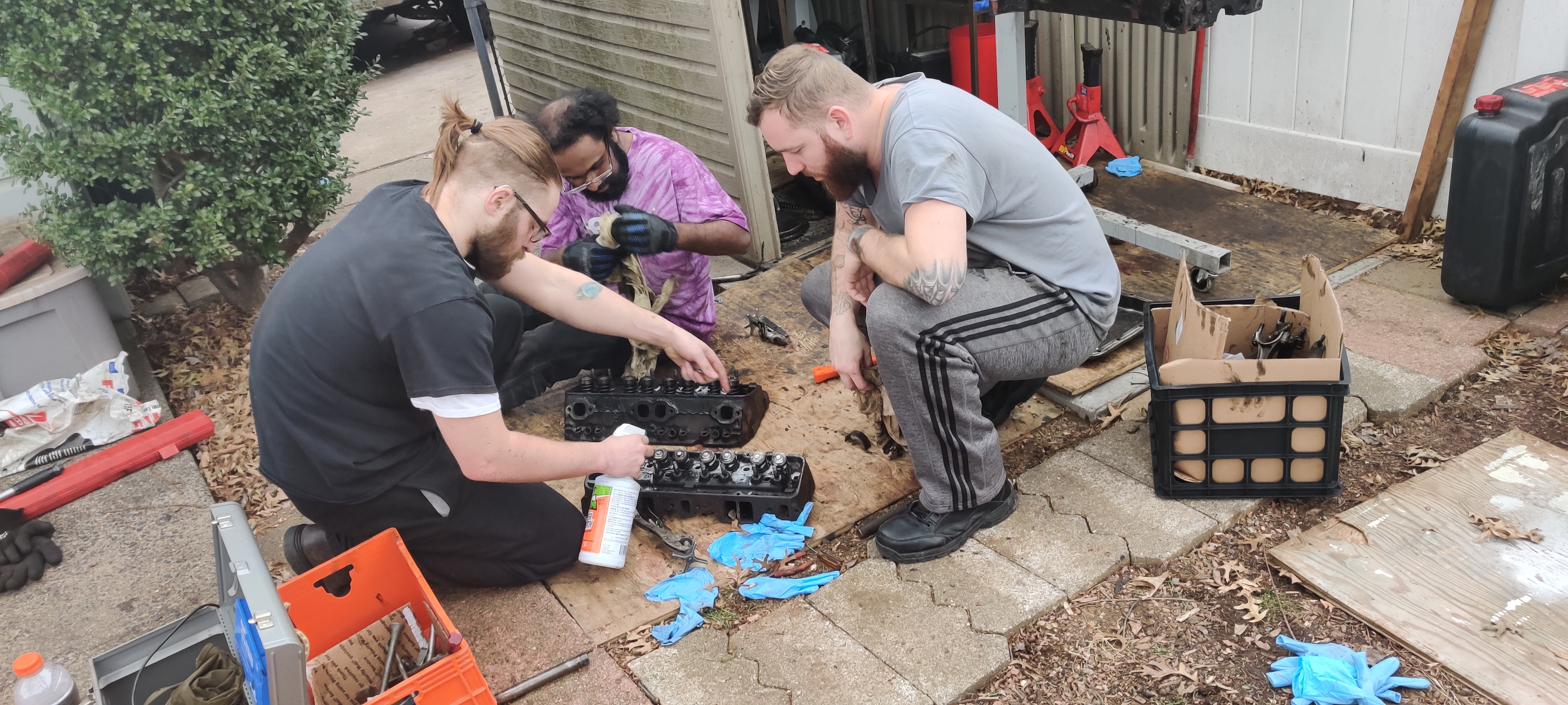 Nick, Stephen, and Brandon try to get the valve springs off